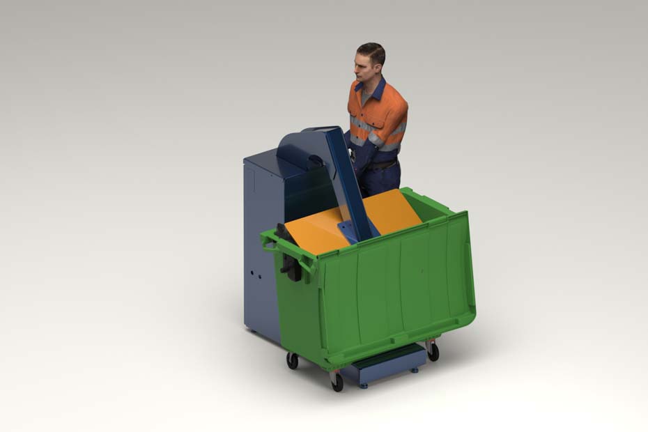 an operator using the 660 compactor to press waste into a bin.