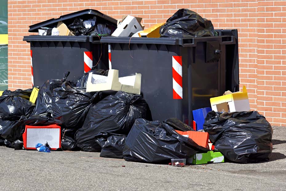 an example of overloaded bins without a bin press compactor.